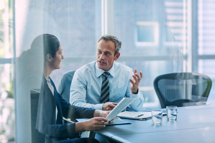 Businesspeople discussing strategy in office